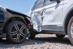 Damaged in heavy car accident vehicles after collision on city street crash site. car accident lawsuit process concept