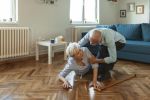 The husband helps his wife to get up from the floor concept