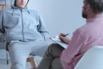 Juvenile offender talking to his curator during a meeting about the diversionary program.