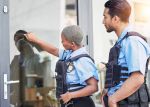 Police officers knocking on a door visual concept for a legal blog discussing search warrant requirements.