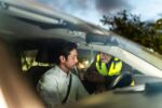Mid adult man doing driver alcohol test on street